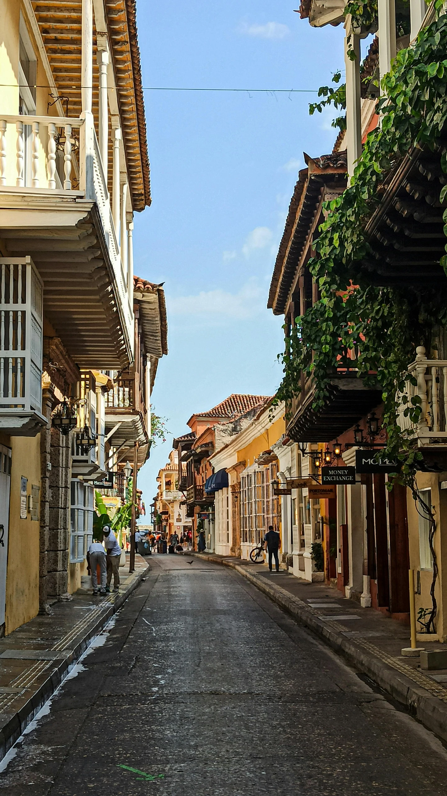 a quiet city street with old, brick buildings on both sides