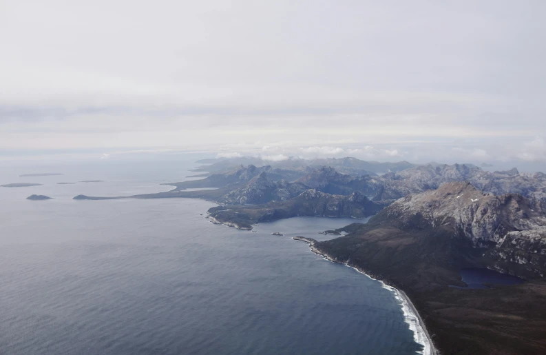 aerial view of an island and several smaller mountains