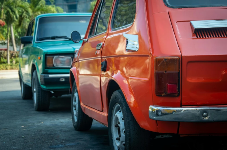 two different vehicles are parked on a parking lot