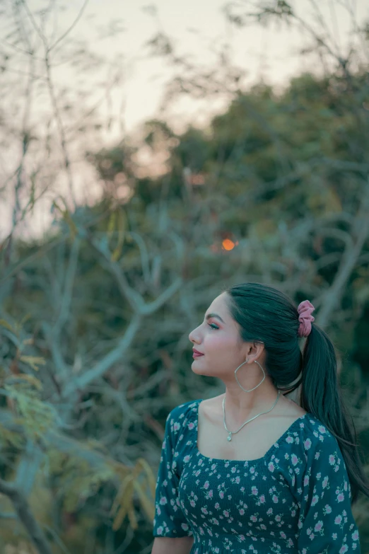 a woman with ponytails and a flower in her hair