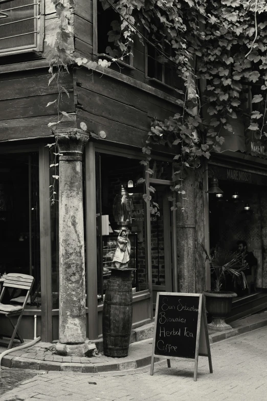 a black and white po of a person outside of an old building