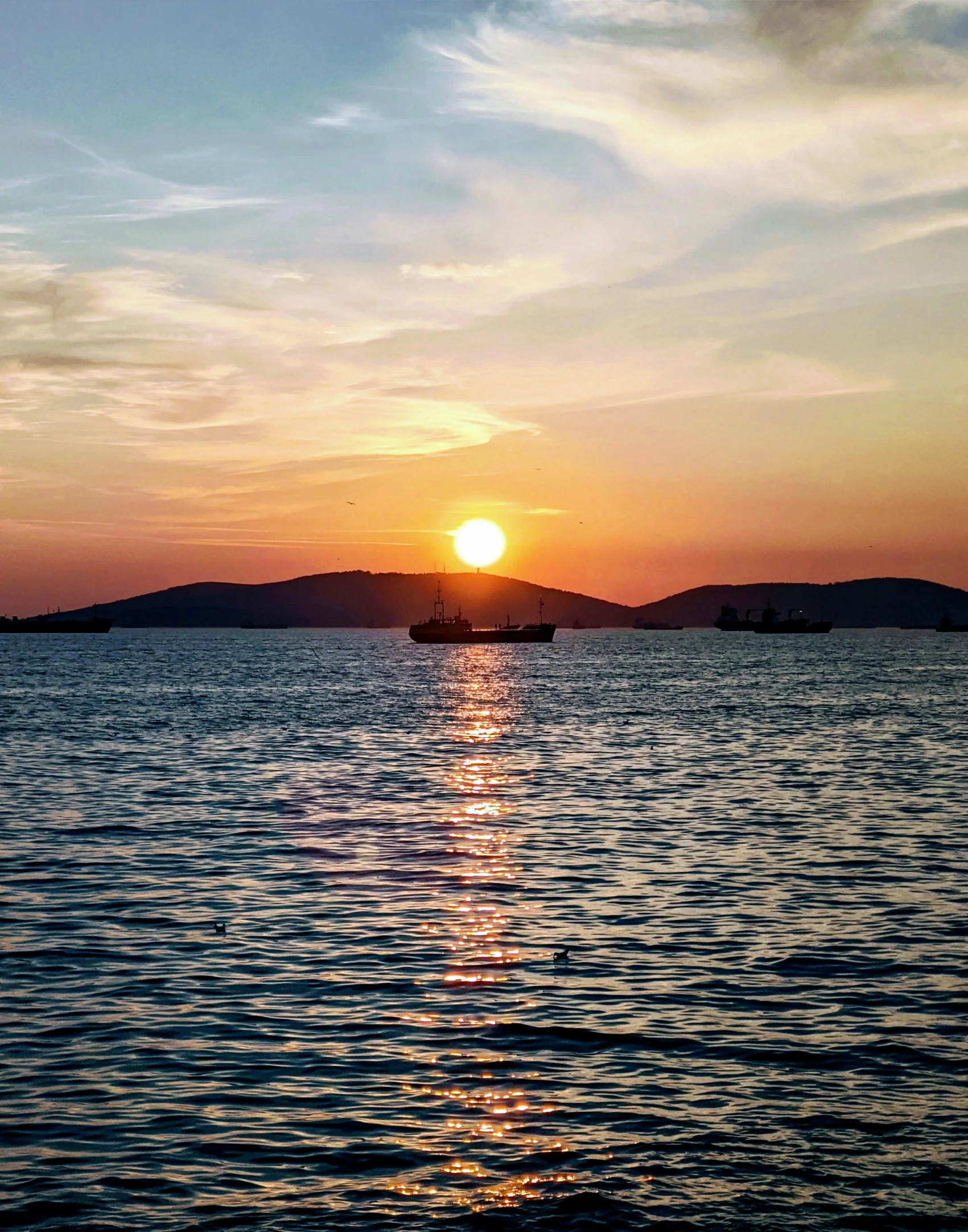 a beautiful day for sailing in the sea, and the sun rising