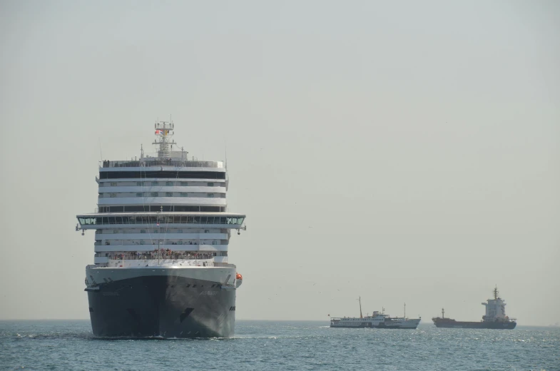 cruise ship sailing in the open sea with another boat out to sea