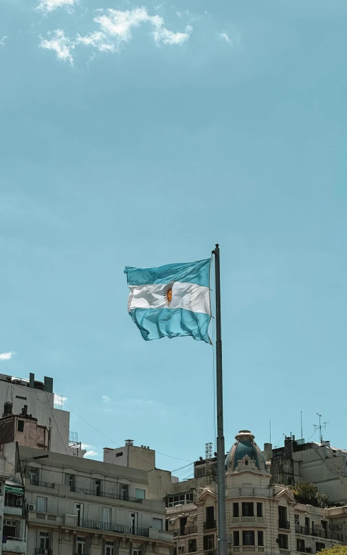 a view of a flag in the wind outside