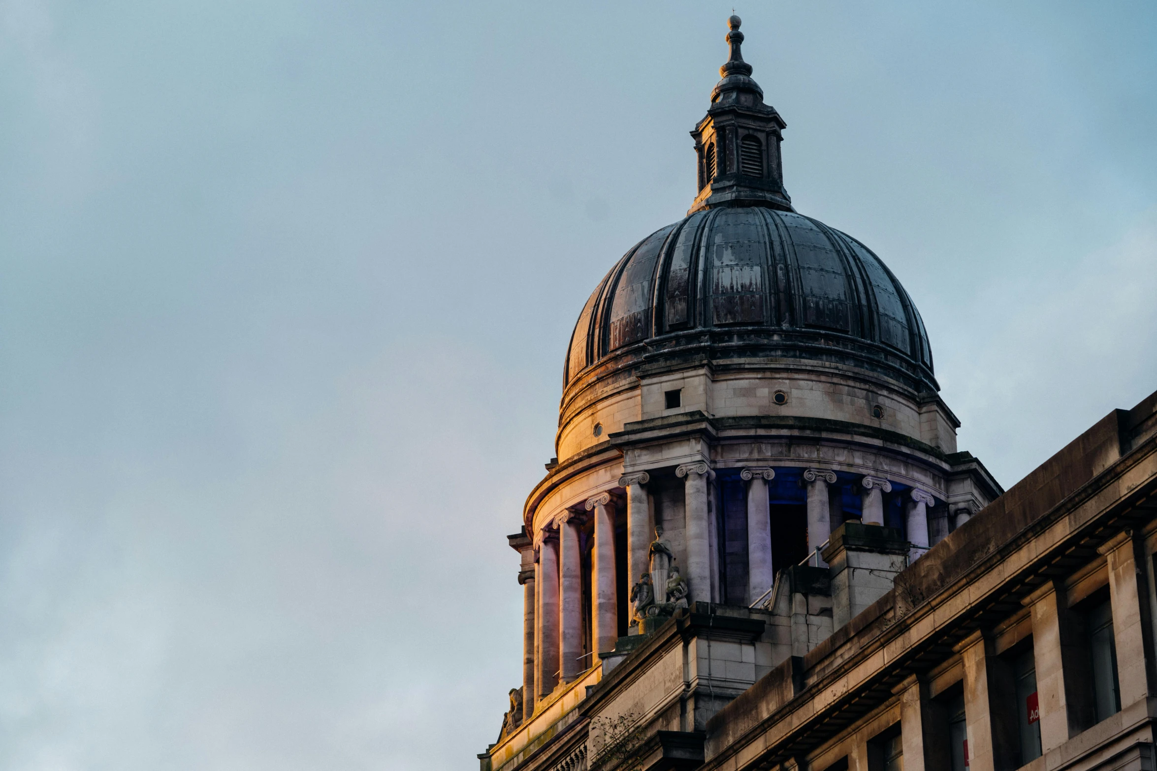 a tall dome sitting on the side of a building