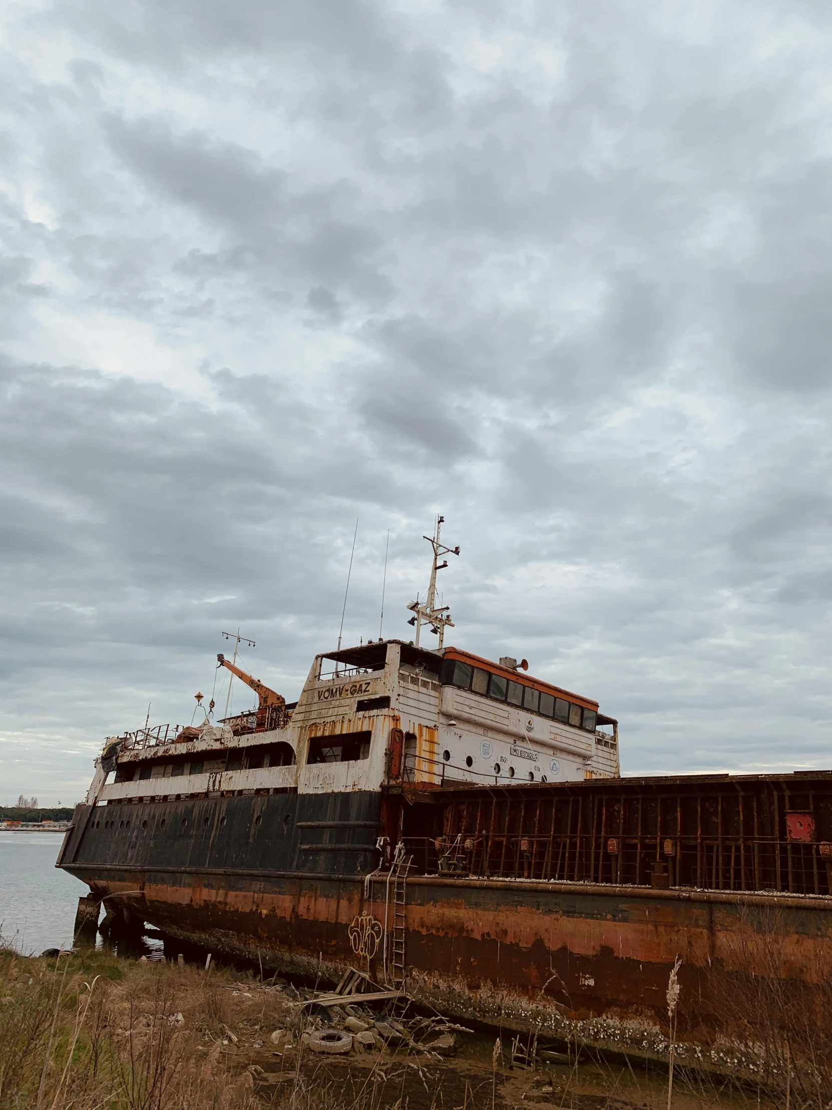 large boat on land at the dock with sky background