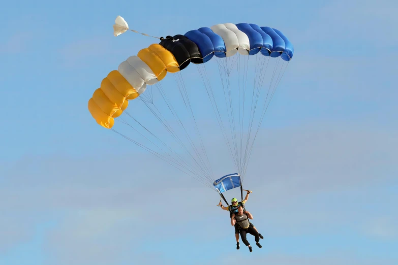 a person is flying on a parachute with some very big sails