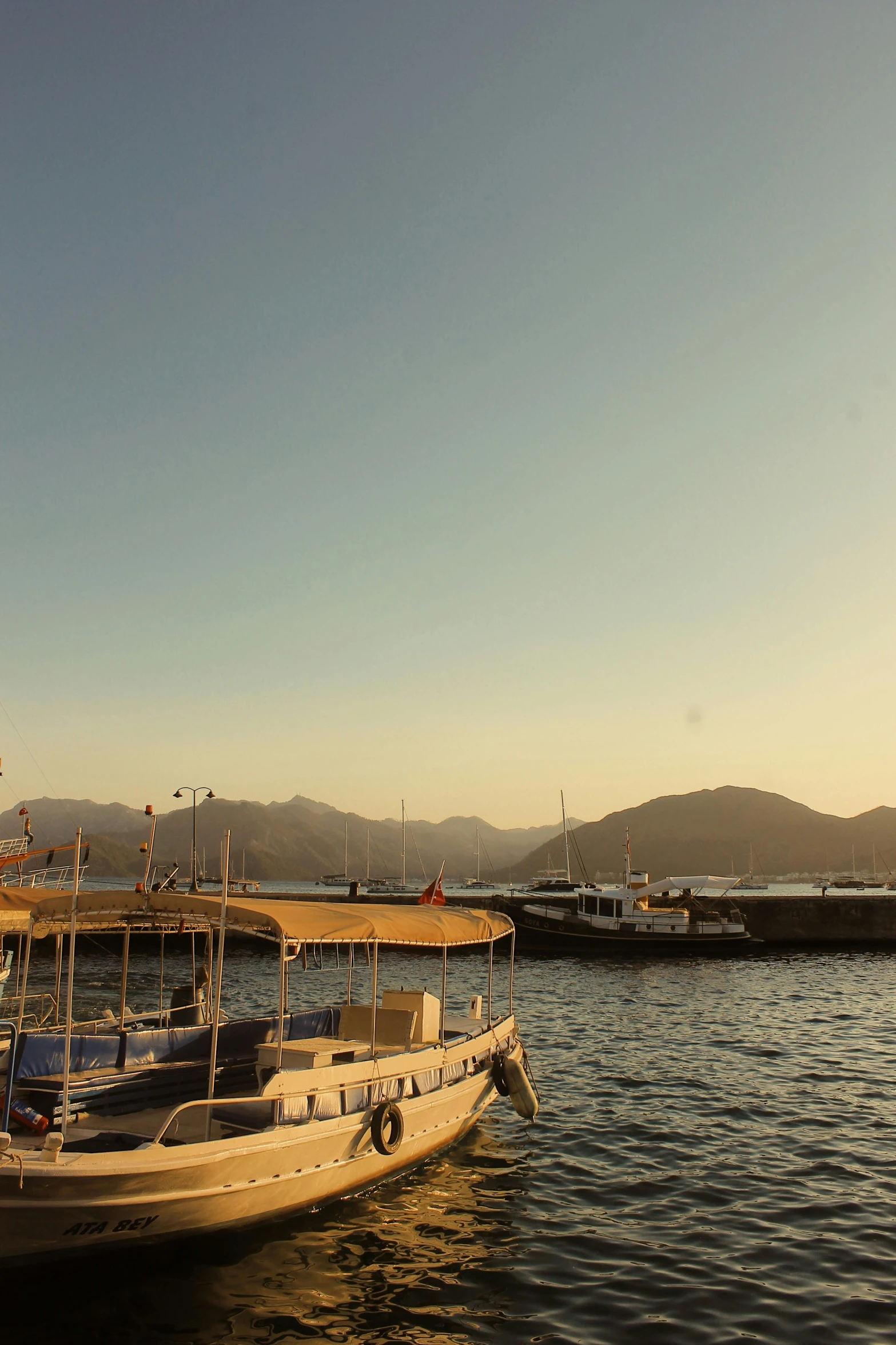 a small wooden boat in a body of water