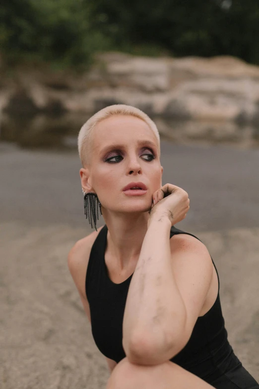 a woman with a very bright skin in a black bodysuit