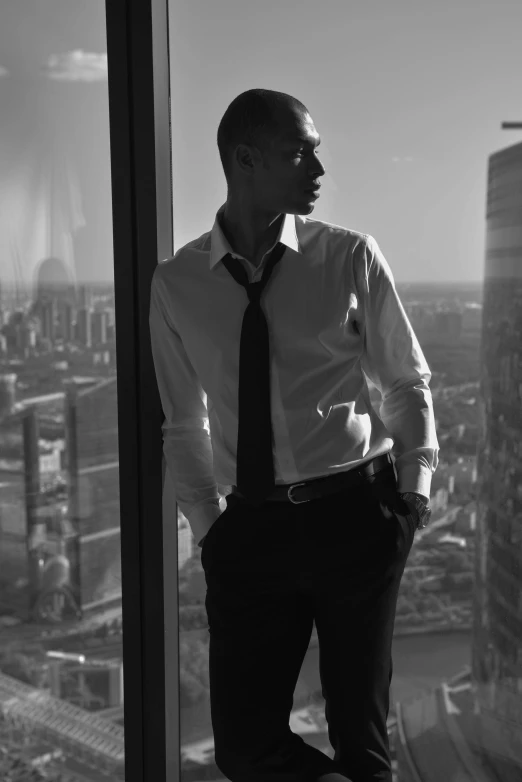 man standing looking out from high up above city