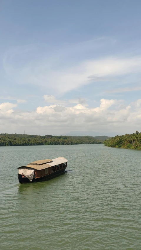 a boat on the side of a lake with a sky background