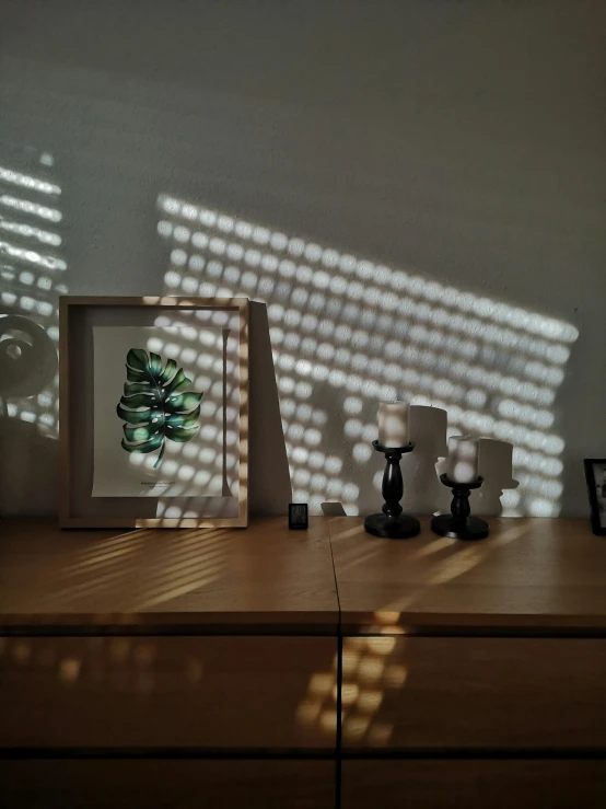 a desk with a shadow of sunlight coming on it