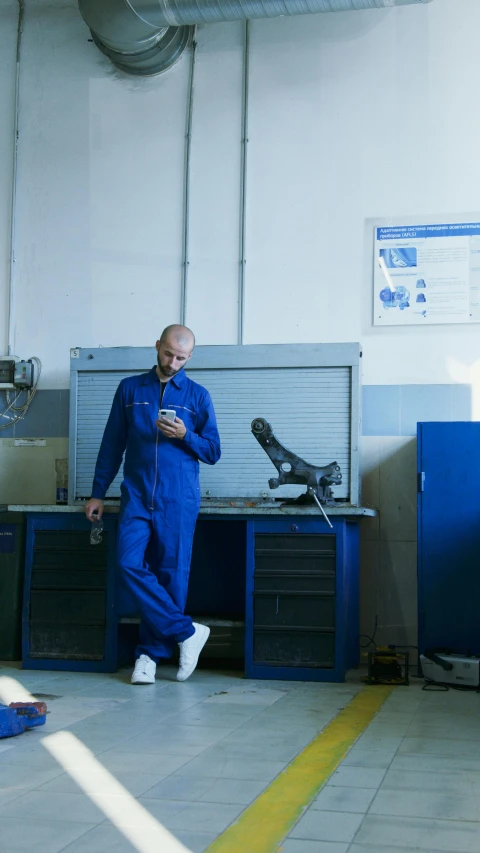 a man in blue is wearing a blue piece of equipment