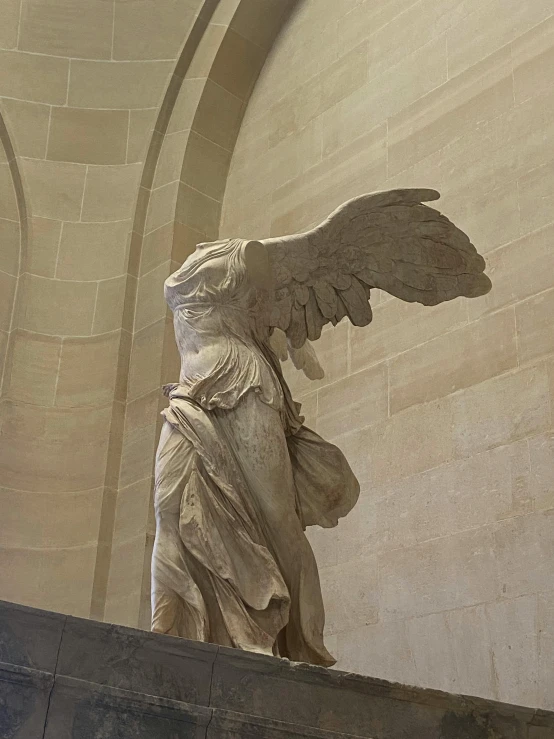 an image of a angel statue in the middle of a room