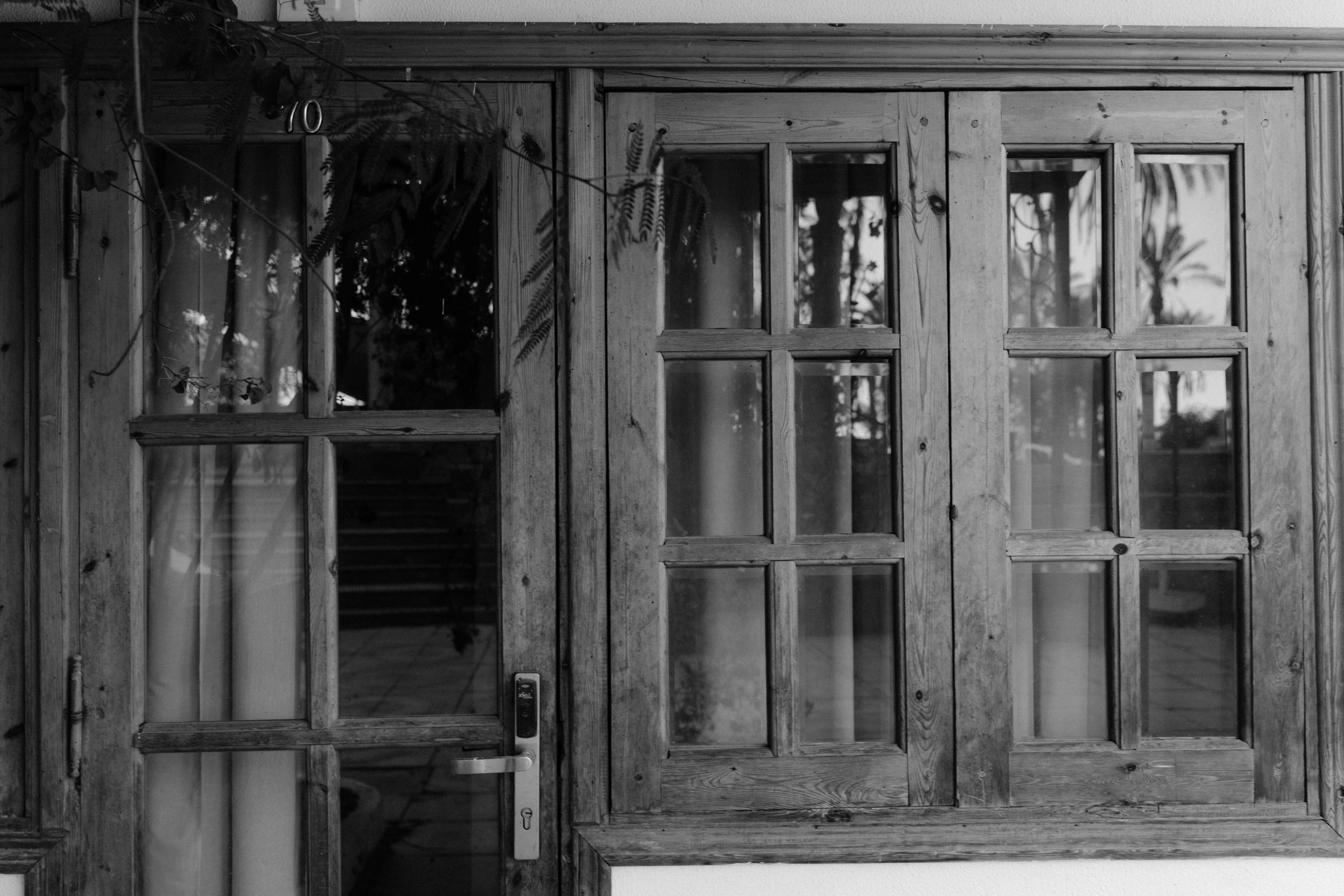 an old pair of doors opened out in black and white