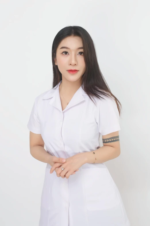 a beautiful asian woman wearing a white uniform