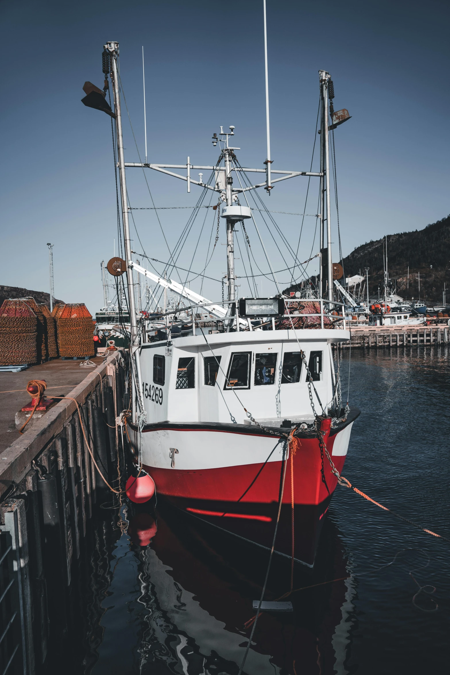 a small fishing boat is docked on the water