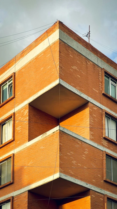 a tall brick building with a lot of windows