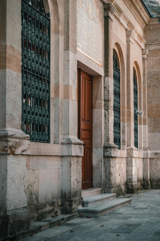 a wooden door on an old looking building