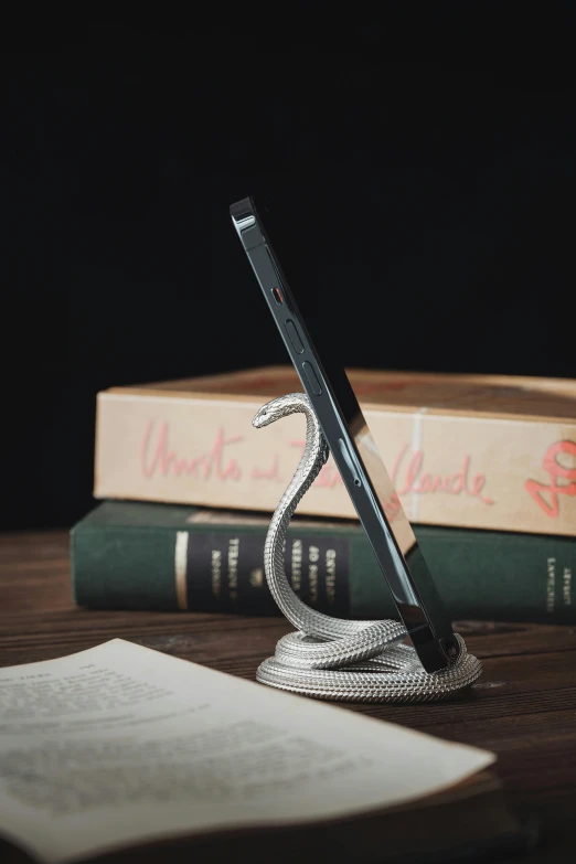 a pen, bookend and two books on a table