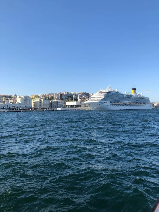 an ocean liner and cruise ship in the background