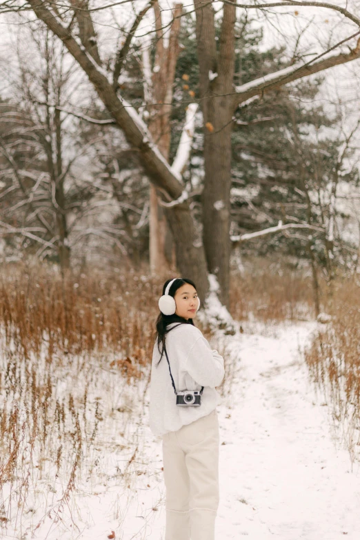 a young child is looking up at the sky in the snow