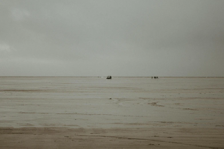 a group of people out in the ocean near the beach