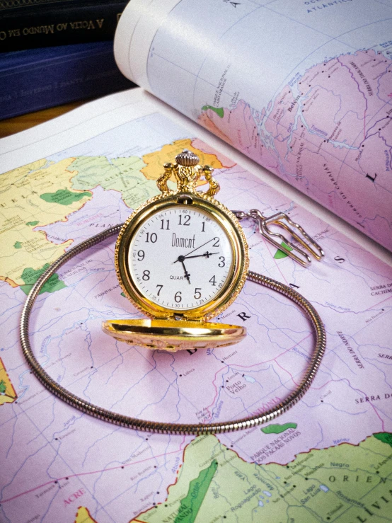 a compass and watch on a map of europe