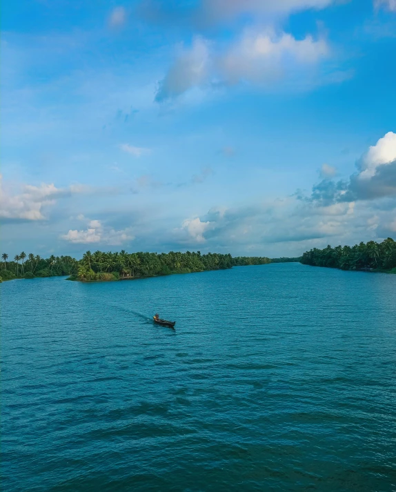 two people paddling in a canoe on the water