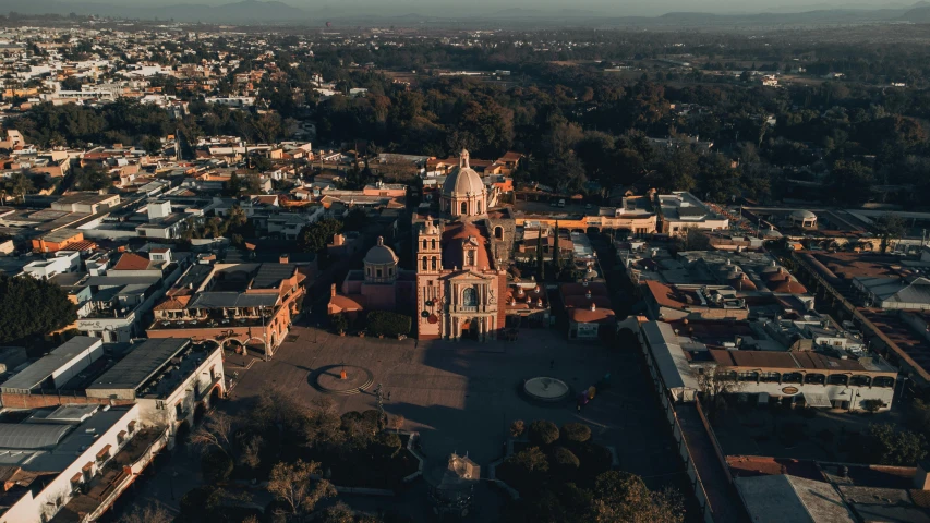 this is an aerial view of a church in a village