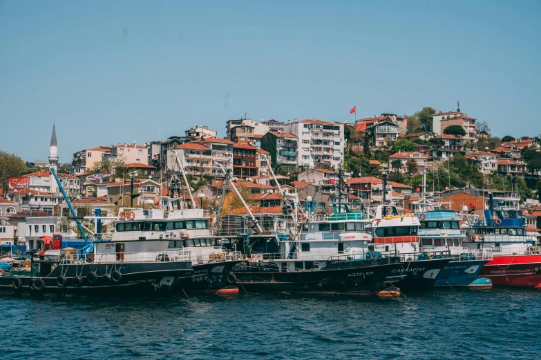 the harbor at a marina is lined with several boats