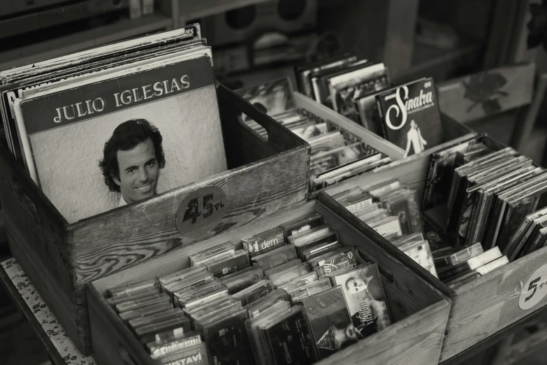 a wooden case with vinyls and cds