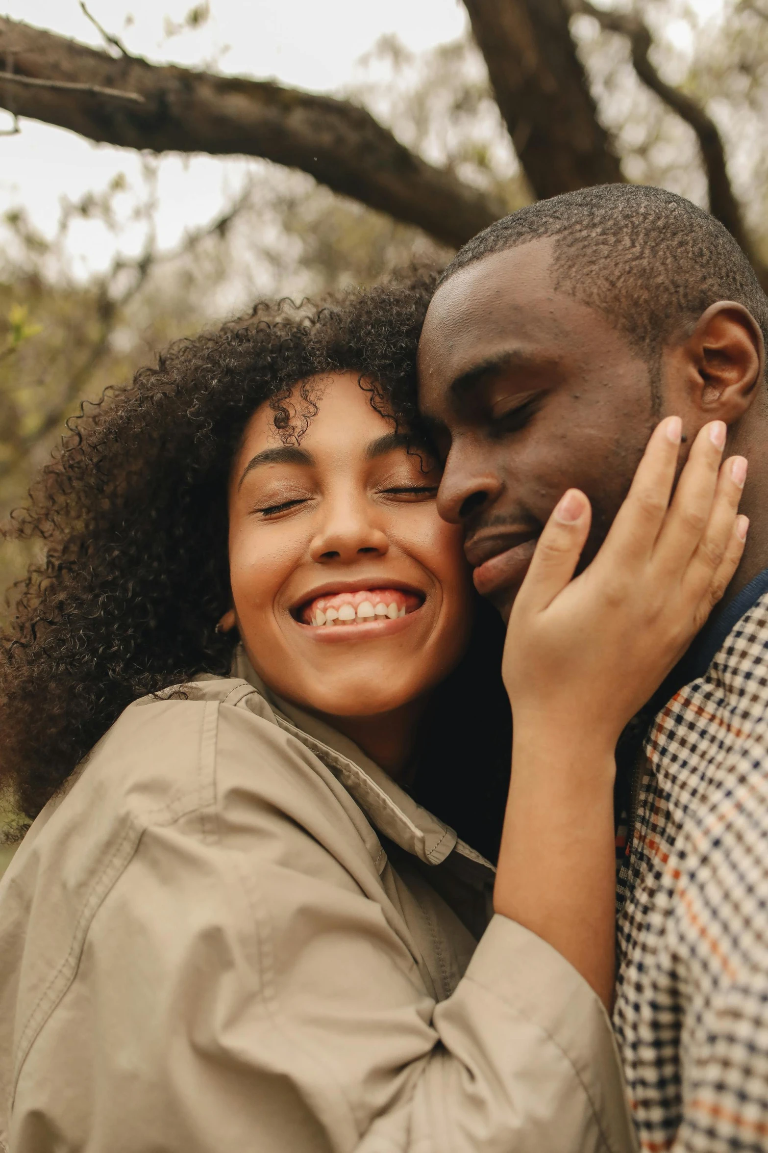 two people emcing, each holding their heads to the other