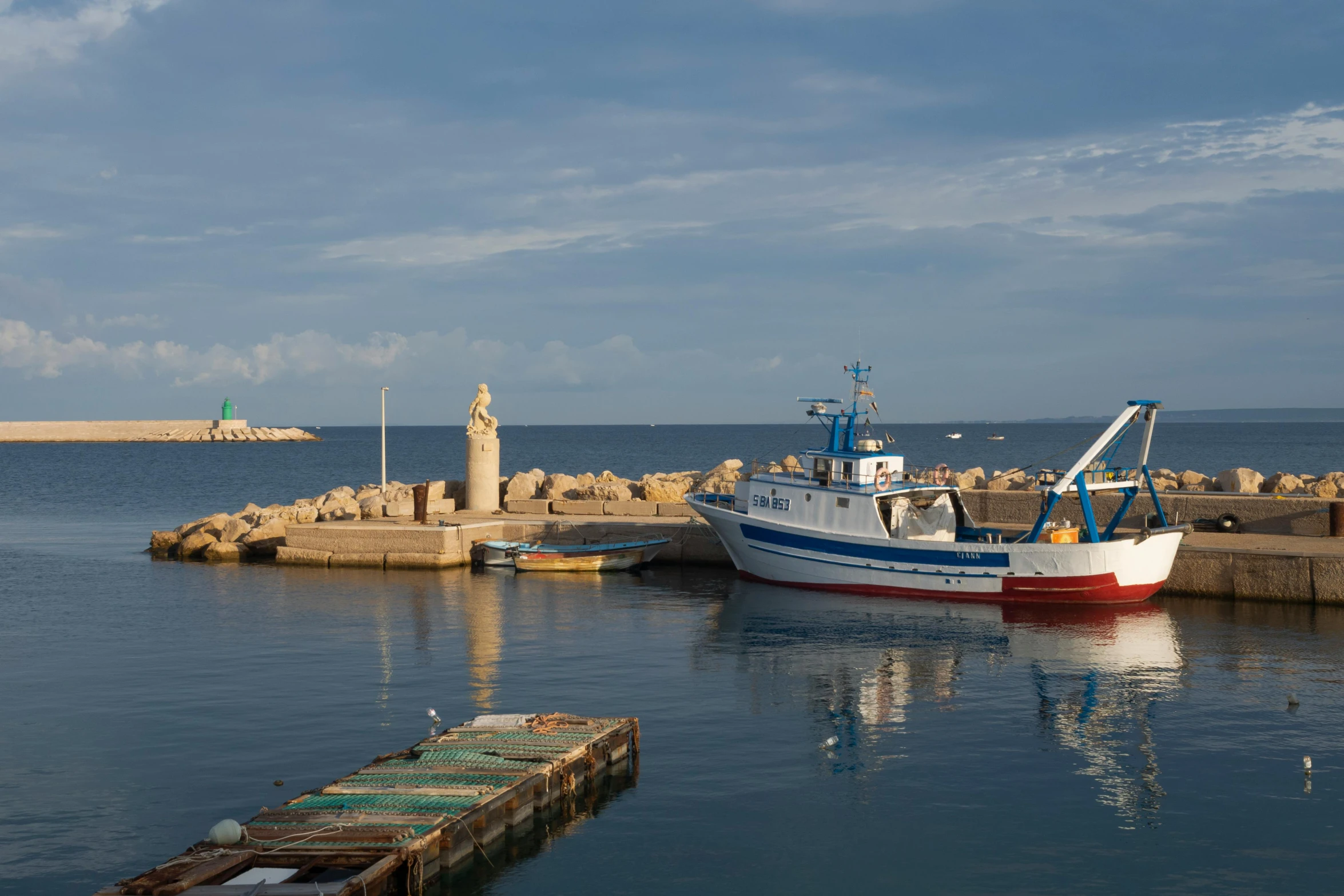 a boat is docked near a dock in the water