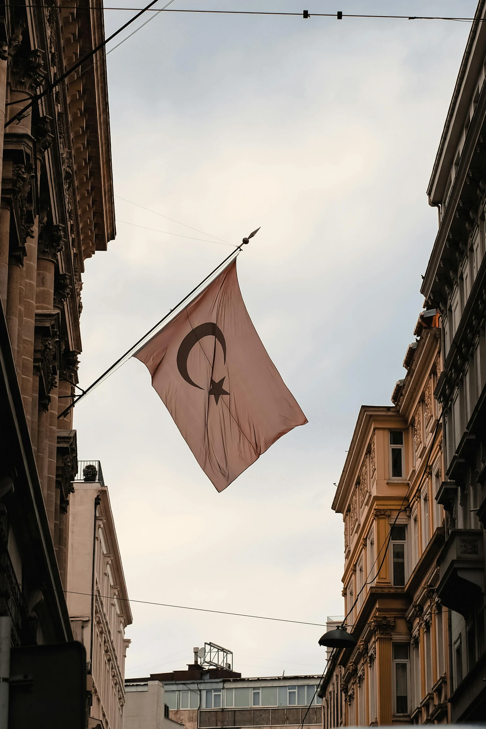 a flag is flying next to some buildings