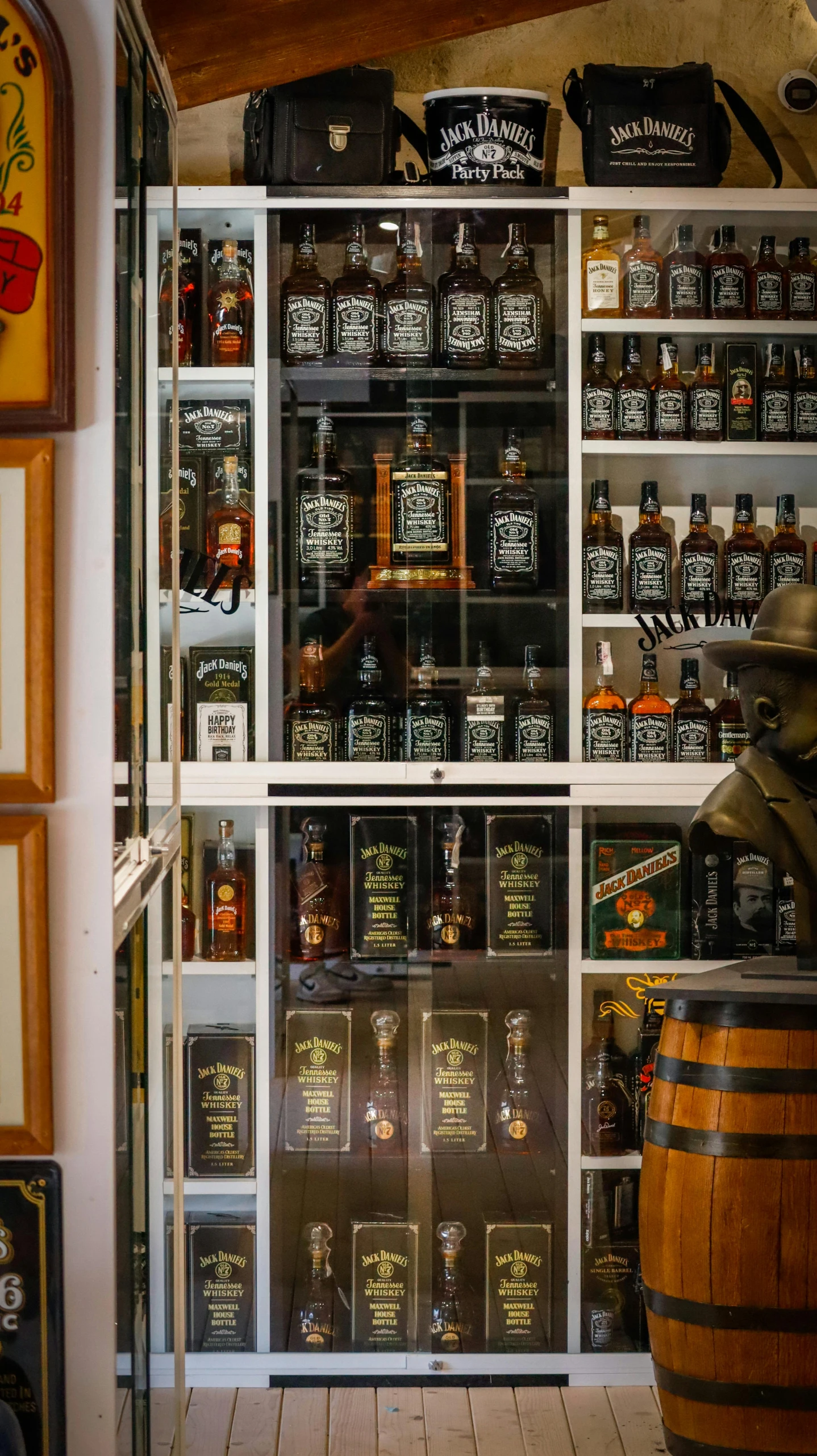 there is a room with glass shelves filled with bottles