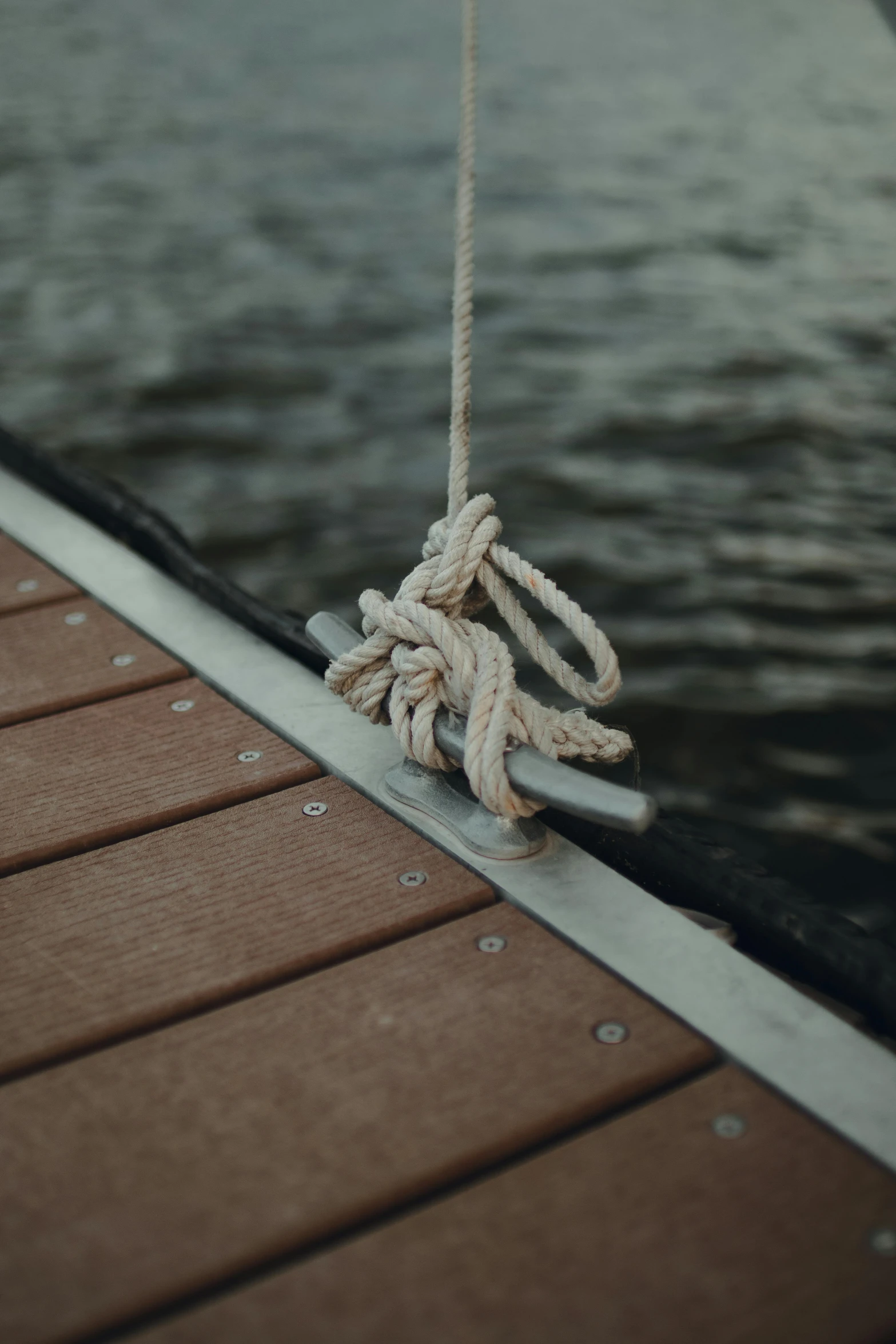 a rope on a deck near the water