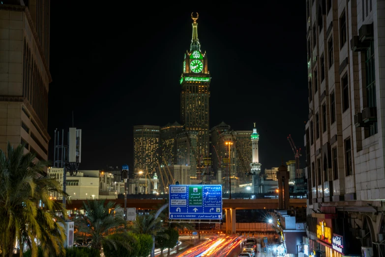 cityscape with buildings lights and a large clock tower