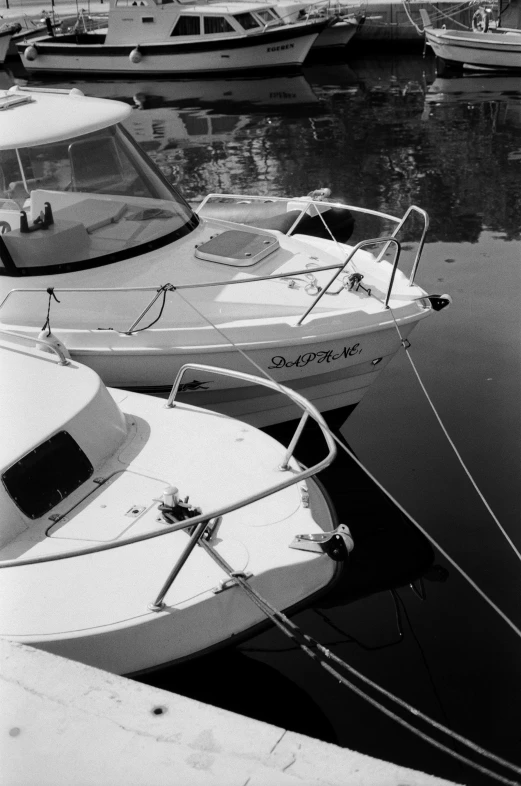 black and white po of boats tied up in water