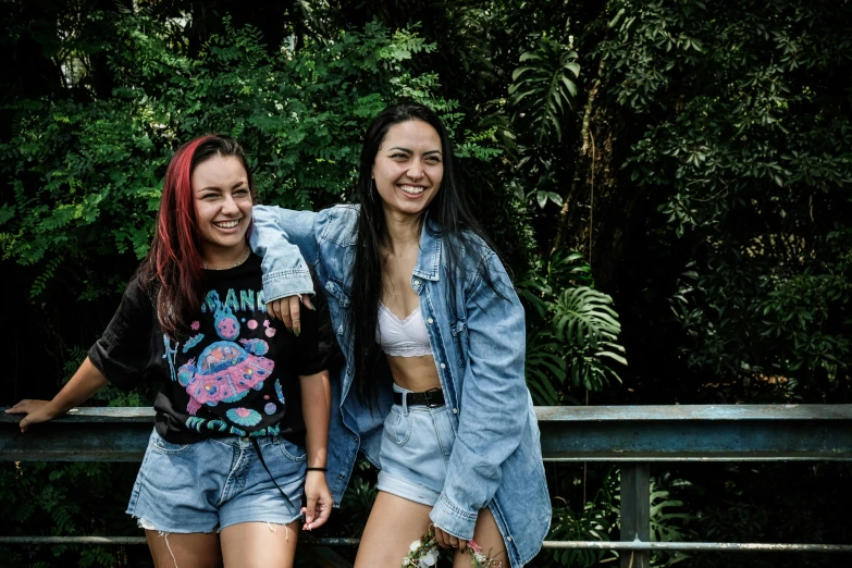 two young ladies are posing for a po together