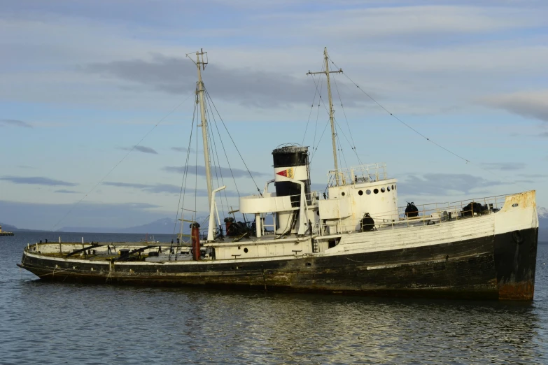 a large boat sitting in the middle of water