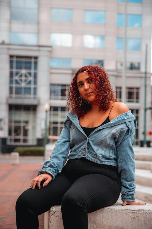 a woman sitting in the middle of some steps