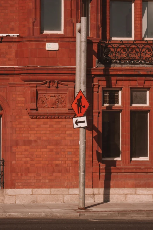 red and white traffic sign attached to a pole