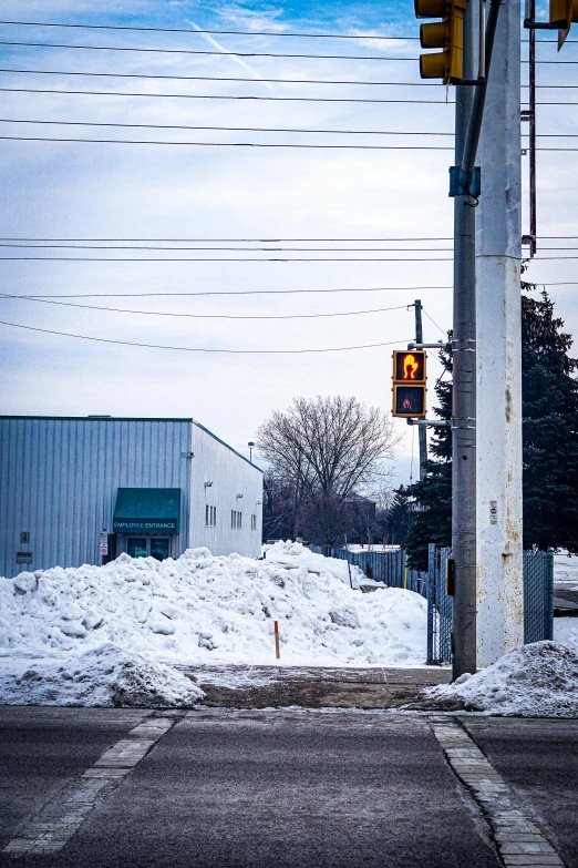 this is a traffic light with snow on the ground