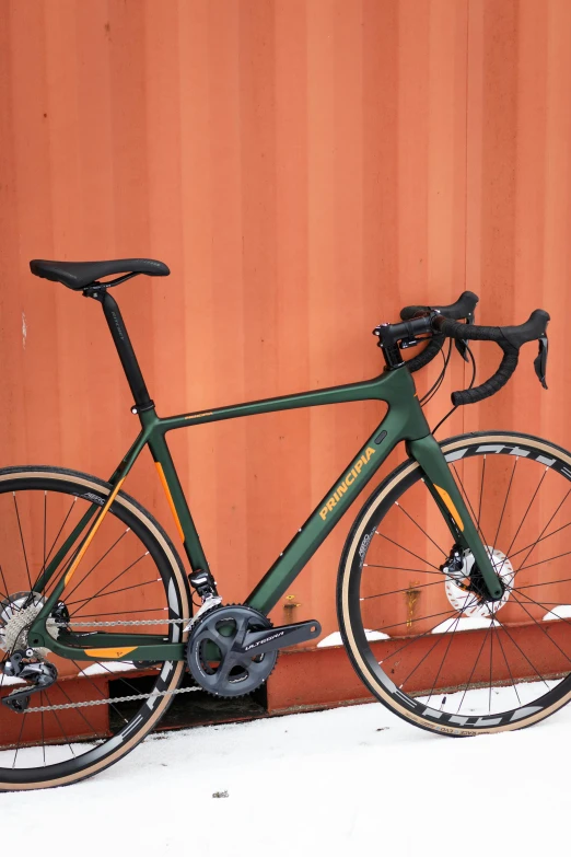 a bike with a metal seat on the side of a road