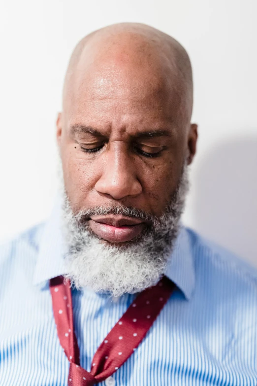 a man with a red tie and blue shirt