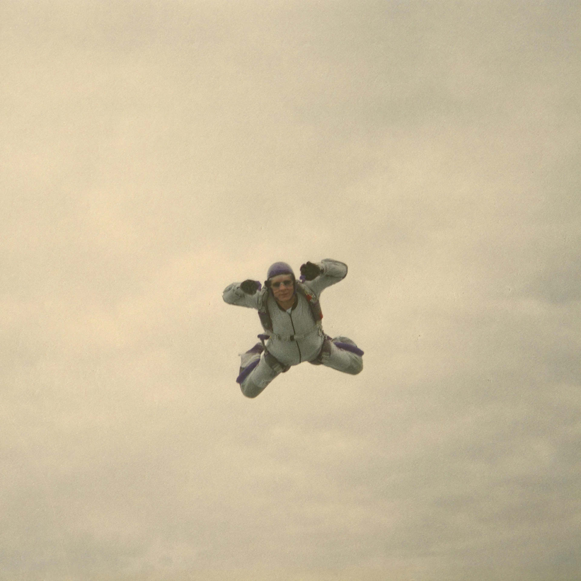 a young man flying through the air while holding onto his teddy bear