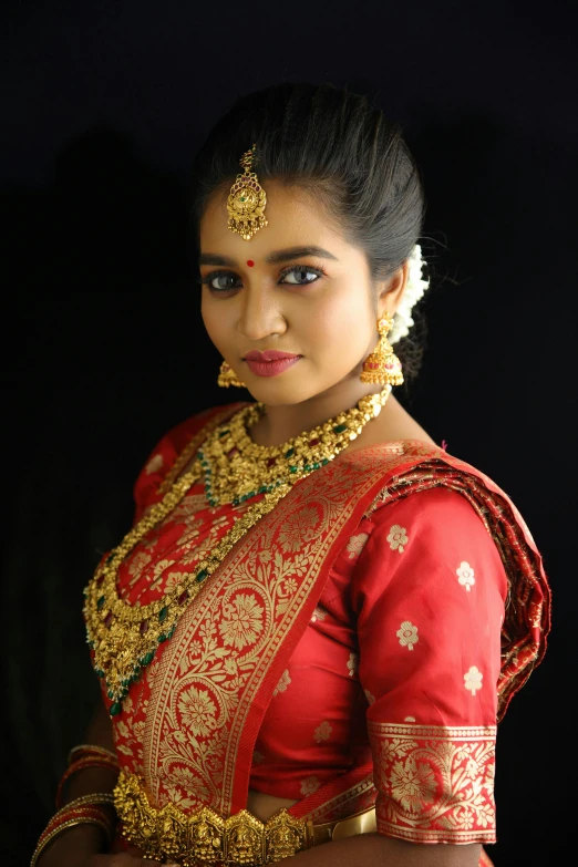 a young woman with traditional garbana attire and jewelry in india