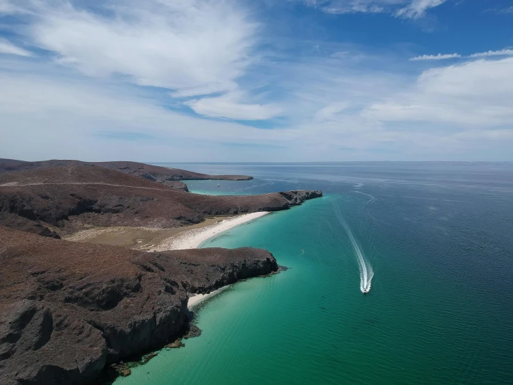 a boat in the water at the beach