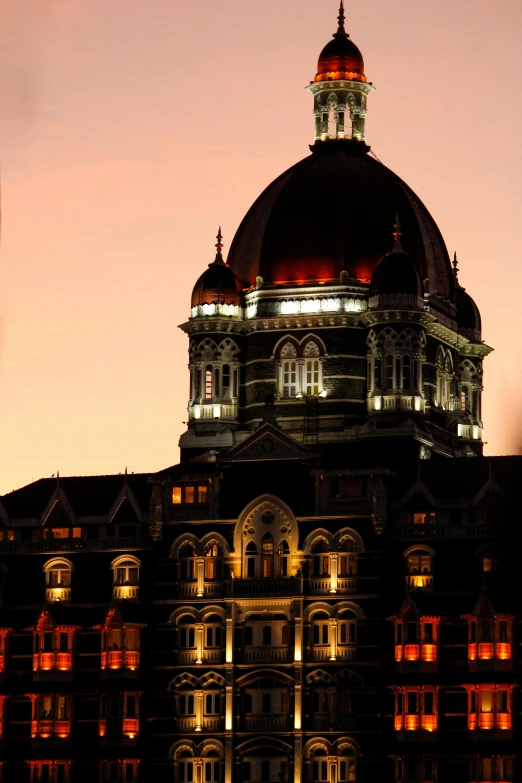 an image of an old building at night time